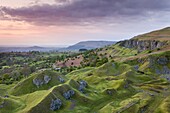 Sunrise over the abandoned quarry workings on the Llangattock Escarpment, Brecon Beacons National Park, Powys, Wales, United Kingdom, Europe
