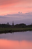 Beautiful sunset over the River Thames and the church spire of Lechlade, Oxfordshire, The Cotswolds, England, United Kingdom, Europe