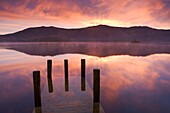 Mist at sunrise over Derwent Water, Lake District National Park, Cumbria, England, United Kingdom, Europe