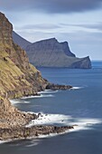 Towering cliffs near Gasadalur on the island of Vagar, Faroe Islands, Denmark, Europe