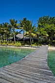 Wooden pier leading to a resort on Aore islet before the Island of Espiritu Santo, Vanuatu, South Pacific, Pacific