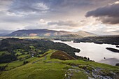 The rising sun lights up the fells of Skiddaw and Blencartha, Lake District National Park, Cumbria, England, United Kingdom, Europe