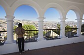 Woman enjoying view from Plaza Anzures, Sucre, UNESCO World Heritage Site, Bolivia, South America