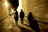 People walking through town at night, Jerusaelm, Israel