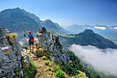 Woman ascending towards La Tournette, La Tournette, Haute-Savoie, France