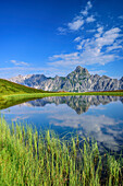 Mountain lake in front of Zimba and Vandanser Steinwand, Raetikon, Vorarlberg, Austria