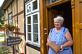 country life, woman sells home made bread, Lower Saxony, Germany