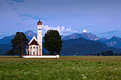 St Coloman pilgrimage church near Schwangau at full moon, view to Tannheimer Berge, Allgaeu, Bavaria, Germany