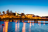 View across Rio Gilao towards old town at twilight, Tavira, Algarve, Portugal