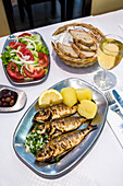 Grilled sardines in a restaurant, Algarve, Portugal