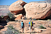 Hikers on the sandstone Esplanade of the Thunder River Trail below the North Rim of the Grand Canyon outside Fredonia, Arizona November 2011. The 21.4-mile loop descends 2000-feet in 2.5-miles through Coconino Sandstone from the Bill Hall trailhead to con