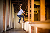 Skateboarding in deserted hotel, Bali, Indonesia.