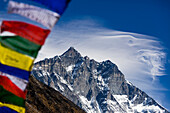 Prayer flags with Lhotse Shar (8386m) in the distance, Sagarmatha National Park, Khumbu region, Nepal.