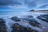 Stormy evening in winter on the beach near Bamburgh Castle, Northumberland, England, United Kingdom, Europe