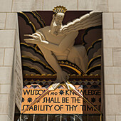 Sculpture and scripture sign, Rockefeller Centre, New York City, New York, United States of America