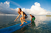 Tourist learning to surf, Samoa