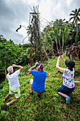 Tourists photographing the land diving ceremony, Pentecost Island, Vanuatu