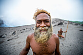 A local landowner standing at the rim of Yasur Volcano, Tanna Island, Vanuatu