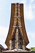 Buffalo horns hung in a vertical array on the front gable of a tongkonan, a traditional Torajan ancestral house in Rantepao, Toraja Land, South Sulawesi, Indonesia