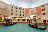 Electric gondolas on canal in the Villagio shopping mall, Doha, Qatar