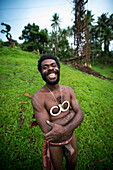 Pentecost Land diver with land diving tower in the background, Pentecost Island, Vanuatu