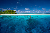 Paddle boarding by a remote atoll of the Marshall Islands, Marshall Islands