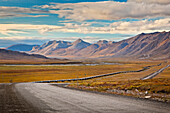 Scenic view of the Trans-Alaska Pipeline along the Dalton Highway and the Brooks Range in the background, ANWR, Arctic Alaska, Autumn