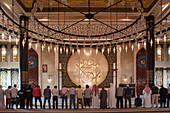 muslim men praying inside the masjid mosque of the katara cultural village, doha, qatar, persian gulf, middle east