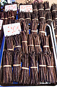 dried vanilla beans for sale on a vendor's stall in the market fair of saint paul, reunion island, indian ocean, france