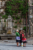 women talking in the street, street scene, rua do souto, porto, portugal