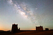 Morocco, Draa Valley, Zagora region, Milky Way and starry sky above kasbah