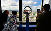 Europe, France, Paris, visitors watching Paris from the top of the Montparnasse Tower, Spotting scope