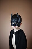 3 years old boy wearing a batman costume