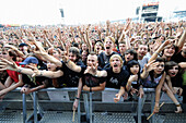 cheering fans at an outdoor rock concert,Germany