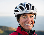 Close up of smiling Caucasian woman wearing helmet