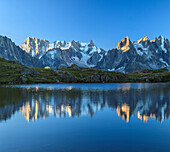 Grandes Jorasses and Dent du Geant reflected at sunrise in Lac des Cheserys, Haute Savoie, French Alps, France, Europe