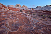 Red and white sandstone swirls at dawn, White Pocket, Vermilion Cliffs National Monument, Arizona, United States of America, North America