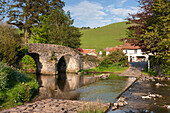 Lorna Doone Farm and stone bridge over the Badgworthy Water at Malmsmead, Exmoor, Somerset, England, United Kingdom, Europe
