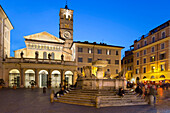 Baroque fountain and Santa Maria in Trastevere at night, Piazza Santa Maria in Trastevere, Rome, Lazio, Italy, Europe