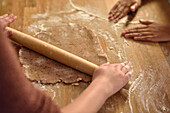 11 years old girls baking christmas cookies, kneading dough, Hamburg, Germany
