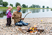 Baking bread on the campfire, Camping along the river Elbe, Family bicycle tour along the river Elbe, adventure, from Torgau to Riesa, Saxony, Germany, Europe