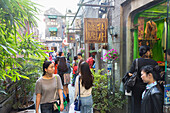 Young women, Tianzifang, arts and crafts area, visitors on street, shops, red lanterns, shopping street, French Concession area, Shanghai, China, Asia