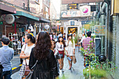 Young women, Tianzifang, arts and crafts area, visitors on street, shops, shopping street, French Concession area, Shanghai, China, Asia