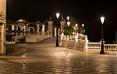 Lampposts illuminated along the promenade at nighttime, Benidorm, Spain