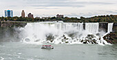 American Falls with the Hornblower tour boat on the Canadian side, Niagara Falls, Ontario, Canada