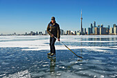 Hockey player and city skyline from Ward's Island, Toronto, Ontario, Canada