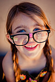Close up of Caucasian girl wearing eyeglasses