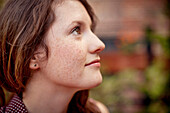 Close up of teenage girl looking up