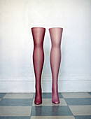 Mannequin legs standing on tiled floor