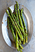 Close up of plate of grilled asparagus